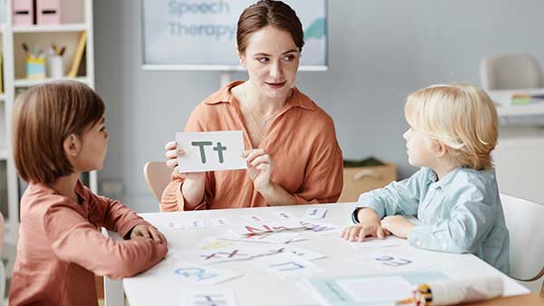 english-teacher-with-children-at-school-2021-12-09-20-03-41-utcz