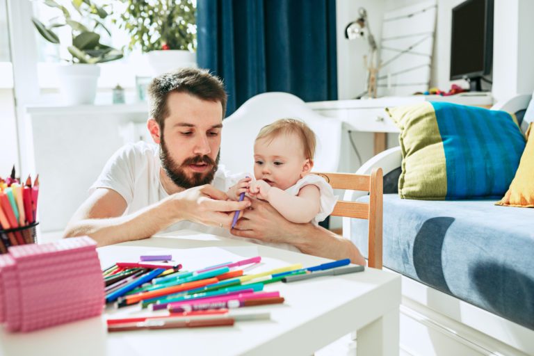 father and his baby daughter at home